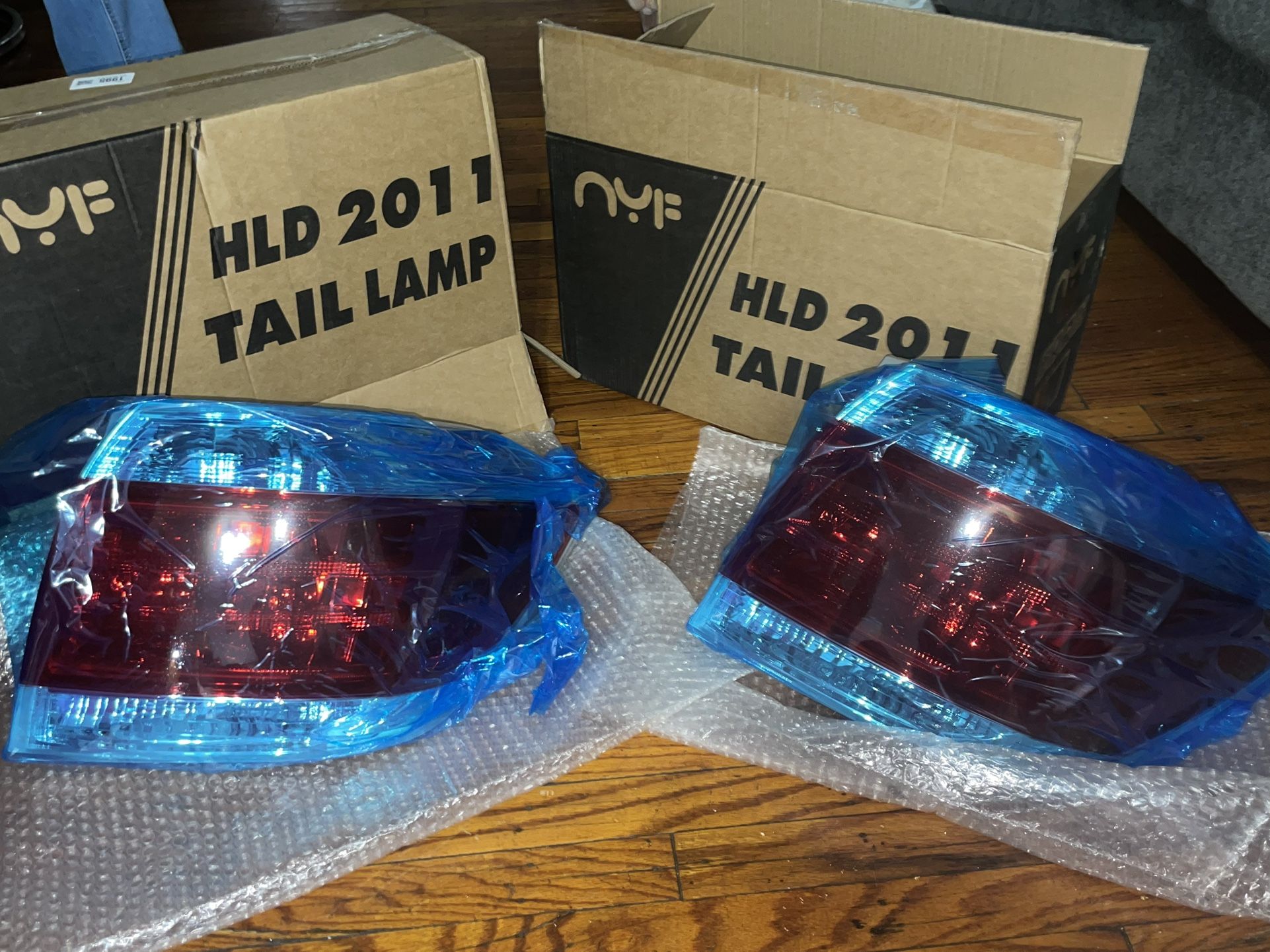 Brand new aftermarket right-side tail light for 2011–2013 Toyota Highlander or Tacoma. Never installed, still in factory packaging. Pickup only, no sh