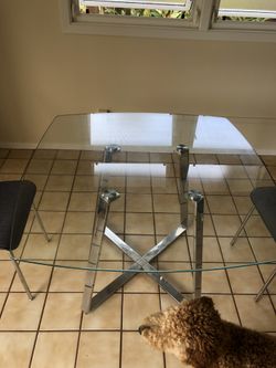 Glass dinning table- has some rust from being stored outside