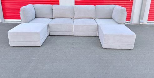 Light Gray Modular Sectional Sofa with Ottomans