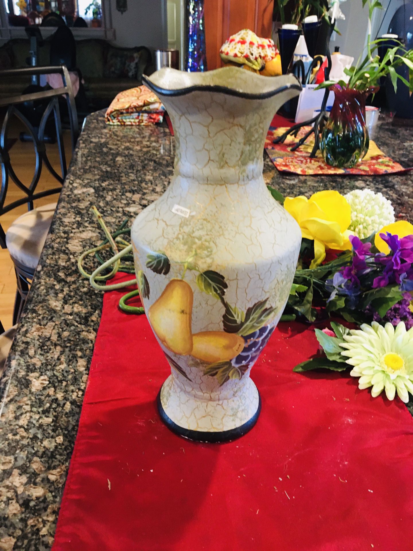 A hand painted vase & flower arrangement