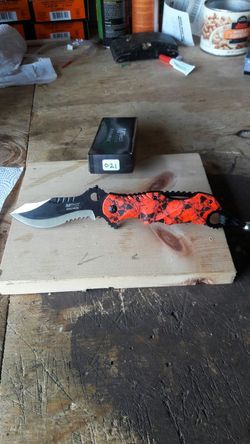 Orange Lock Blade. (New in box).