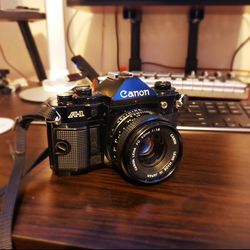 Canon A-1 Black 35mm Film Camera With 50mm Lens