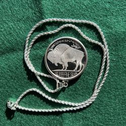 SILVER CHAIN NECKLACE WITH 1 OUNCE PURE SILVER BUFFALO ROUND.