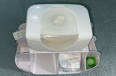 Diapers organizer and a wipes warmer