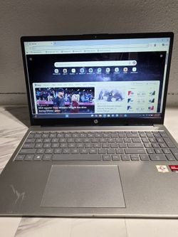 Sleek HP laptop. Has AMD Athlon processor and AMD Radeon Graphics. Features HDMI, USB-C, and USB-A ports.