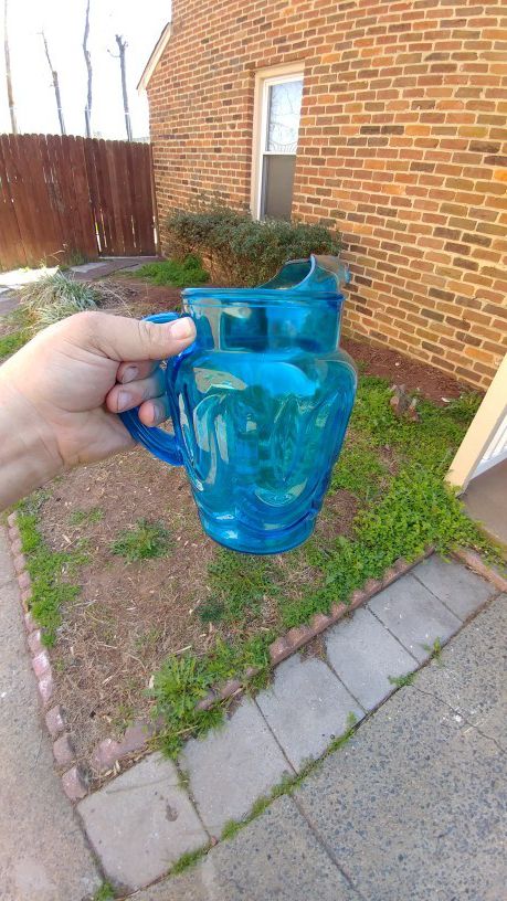 Blue glass pitcher with an ice catcher