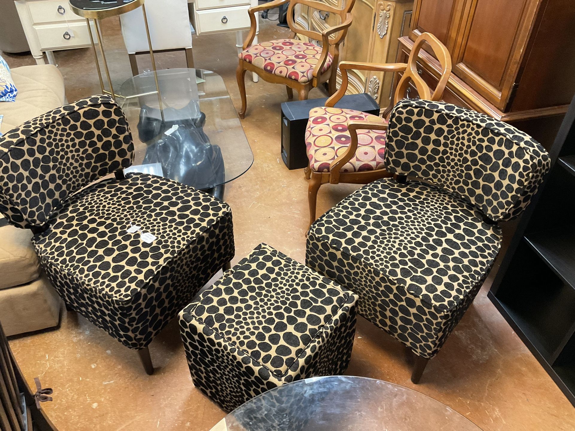 Pier one leopard print accent chairs and Ottomans