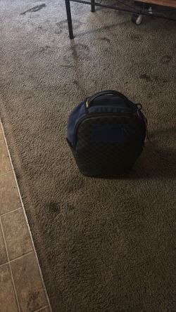 Blue and black spray ground bag