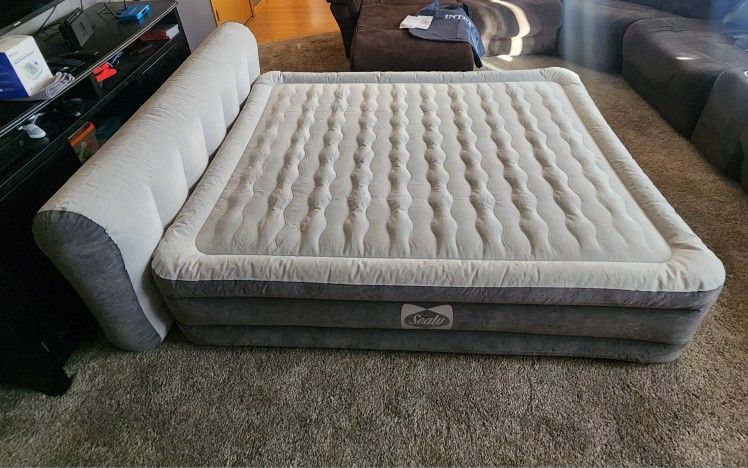  Sealy Tritech Queen-sized air mattress with a headboard. 