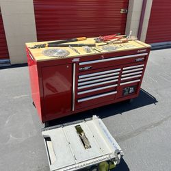 large husky work drawer includes table saw and tools 