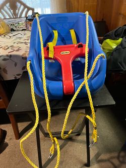Blue high-back swing with a red front bar, known as the Little Tikes 2-in-1 Snug 'n Secure Swing; supports up to 50 pounds (approx. 22.6 kg)