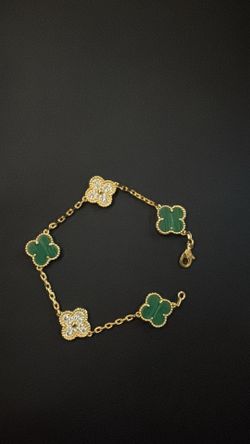 Green and gold plated flower bracelet $50