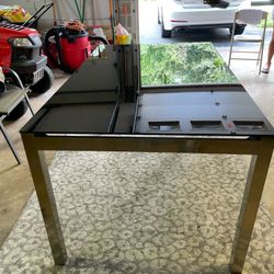 Black Glass Top Table with steel legs from Ashley furniture 5ft L x 3ft W x 30” H (no chairs include