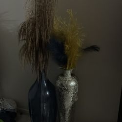 Tall Navy blue vase with gold Flowers and tall silver vase gold and blue feathers