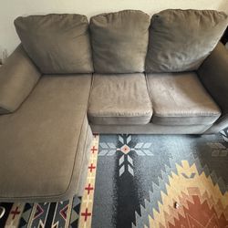 Grey Couch With clean sleeper 