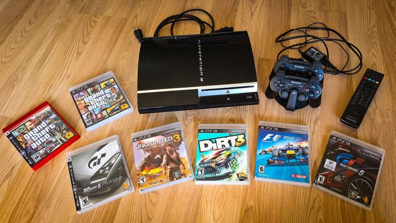 PlayStation 3 + 2 Controllers + Charging Dock + 7 Games + Remote