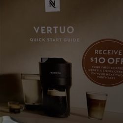 Nespresso Vertuo Machine With A Sleeve Of Coffee