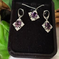 New, Custom Made, Sterling Silver Pendant and matching earrings with CZ’s and each piece hosting a 9x11mm amethyst. On SS 18” chain