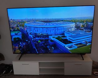 Samsung 75" TV with a stylish white TV stand