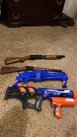 Two nerf guns and two toy guns