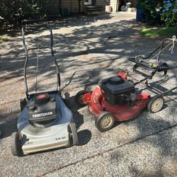 Two Small Engine lawn mowers