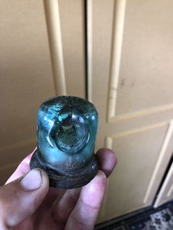 Small green glass antique insulator