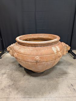 Ornate Terracotta-Style Planter with Lion Head Accents