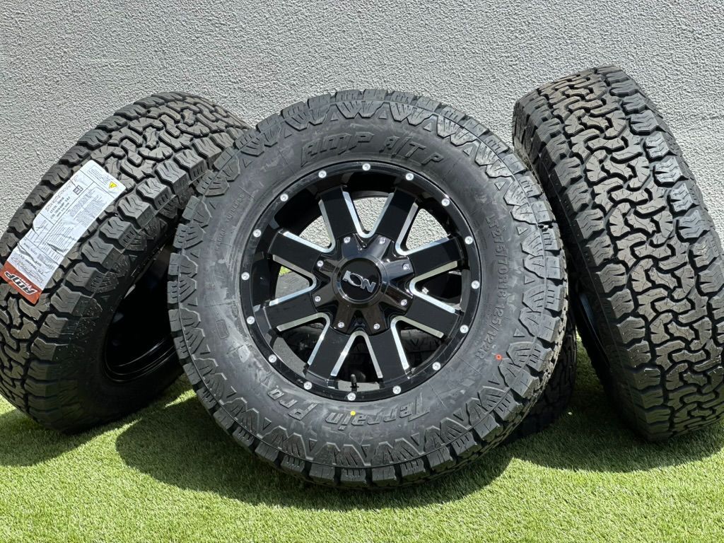 NEW ION 2025 18” GMC Sierra 2500 Wheels Sierra 3500 rims Black A/T tires 8x180 Chevy Silverado AT4