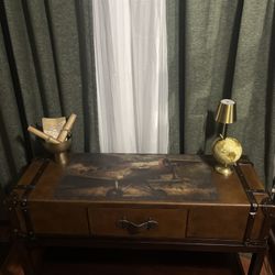 Vintage, trunk-inspired suitcase, table with unique travel-themed accents.