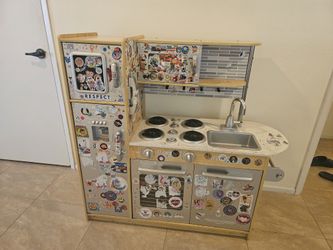 KidKraft Uptown Kitchen with fruits, vegetables, and plates