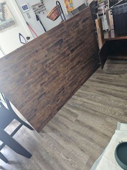 Wooden dining table with storage