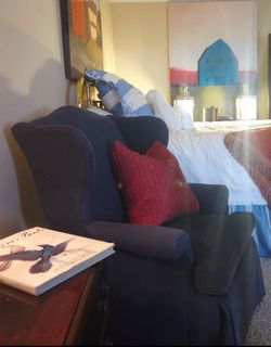 TWO NAVY WINGBACK CHAIRS