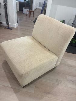 Ivory armless plush chair