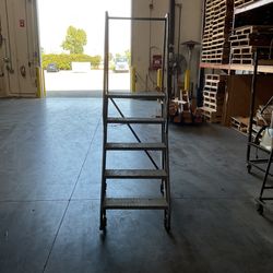 Rolling Metal Ladder 48 Inches In Height $200 OR BEST OFFER