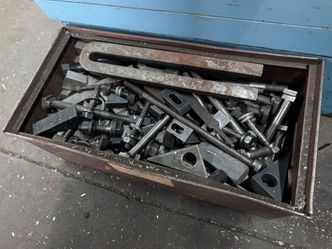 Large bin of machinist hold down clamps