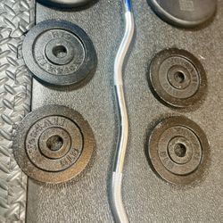 Standard Steel Curl Bar with Cast Iron Weight Plates pairs: 15#, & 4X 5 #. Total: 66 pounds