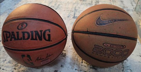 Two basketballs one Spalding and one nike. Spalding $15 Nike $10. 20 together.