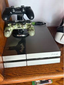 PS4 with two controllers and charging dock