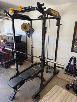 Full squat/bench cage with cables.