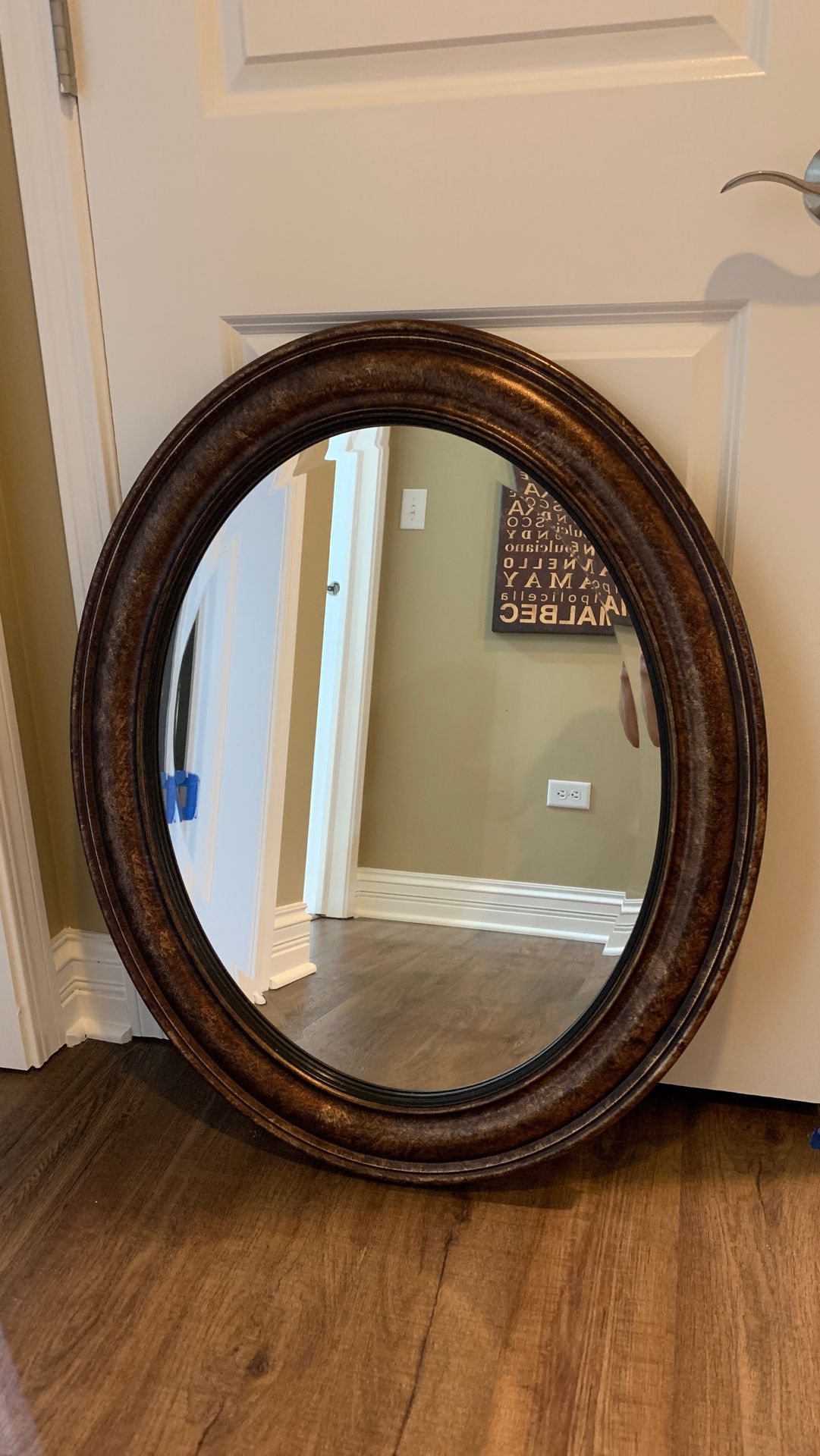 BRONZE AND BLACK OVAL MIRROR
