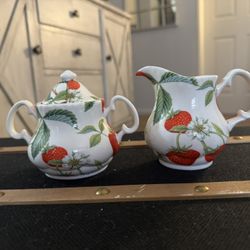 Roy Kirkham Alpine Strawberry sugar bowl with lid and a creamer. Roy Kirkham is known for producing fine bone china in England since 1970. 
