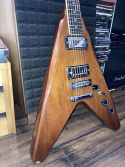 1970’s Harmony Flying V Made in Japan plays and sounds good.  Body: Maple cap with mahogany body Neck: Mahogany neck with a "C" profile, 1 5/8" wide n