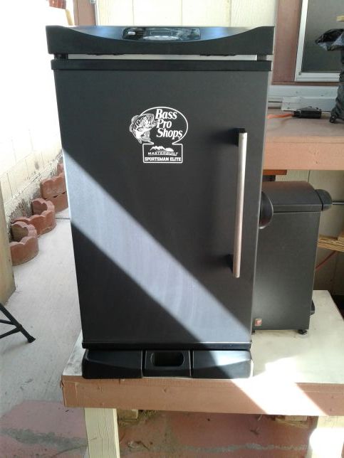 Masterbuilt Sportsman Elite Model 20071414 Electric Smoker (from Bass Pro) with accessories.