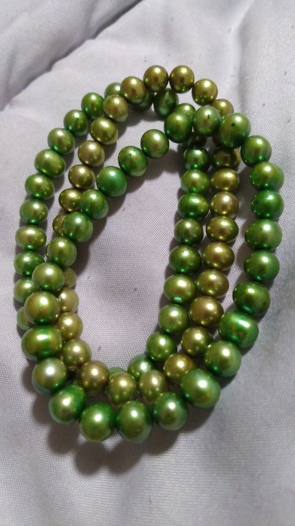 Three Green Pearl Bracelets.  7 Inch Stretch.