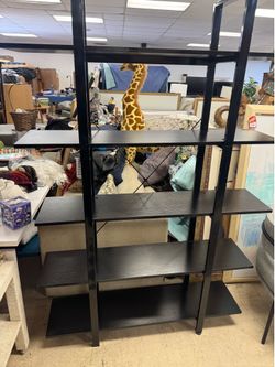 industrial-style bookcase features a sturdy black metal frame - 47” x 11” x 73”