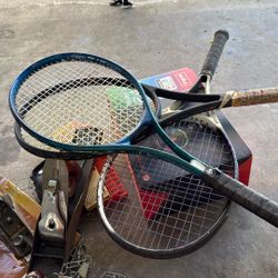three Tennis Racks