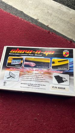 Retractable license plate frame