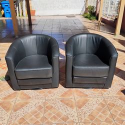 2 Black Leather Turning Chairs