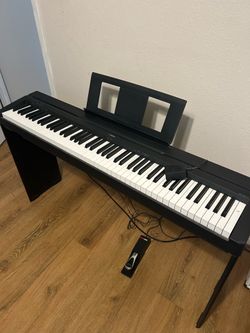yamaha piano with stepping stool