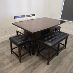 > Bar-Height Dining Table with 5 Chairs – Solid Wood with Storage Drawers (Excellent Condition)